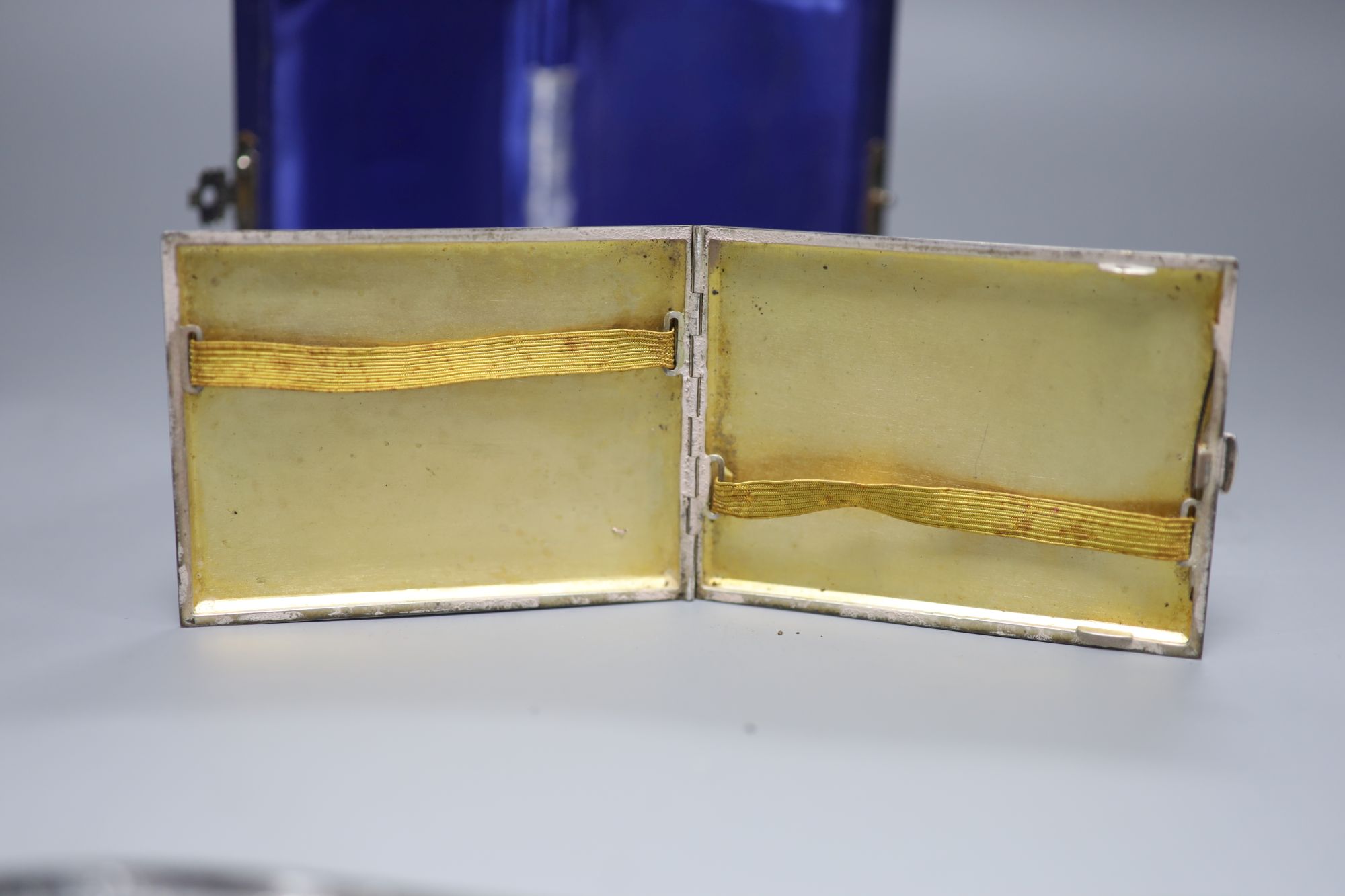 A 20th century Austrian engraved 900 standard white metal cigarette case, 10.3cm, gross 5oz.